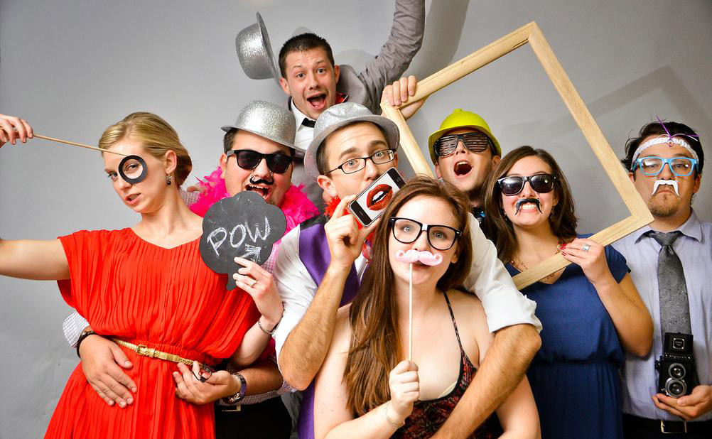 Group of people posing for photobooth