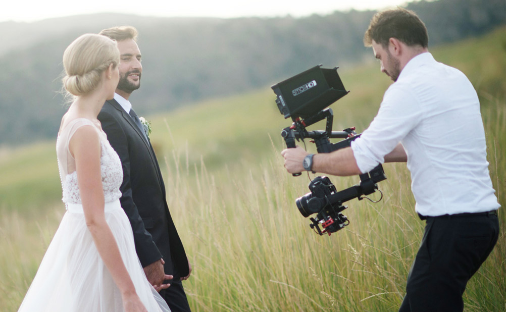 Wedding videographer captures bride and groom