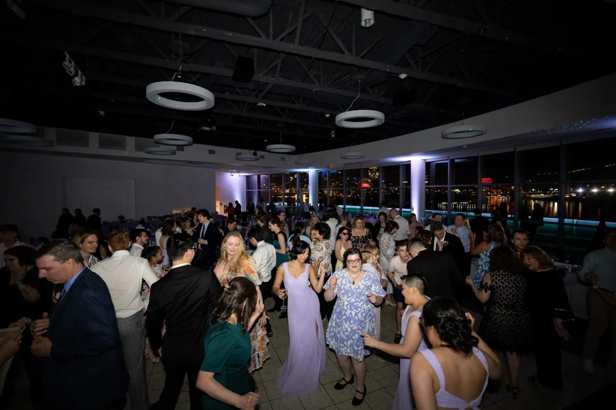 Wedding guests on dance floor dancing to wedding music - how to dance at a wedding