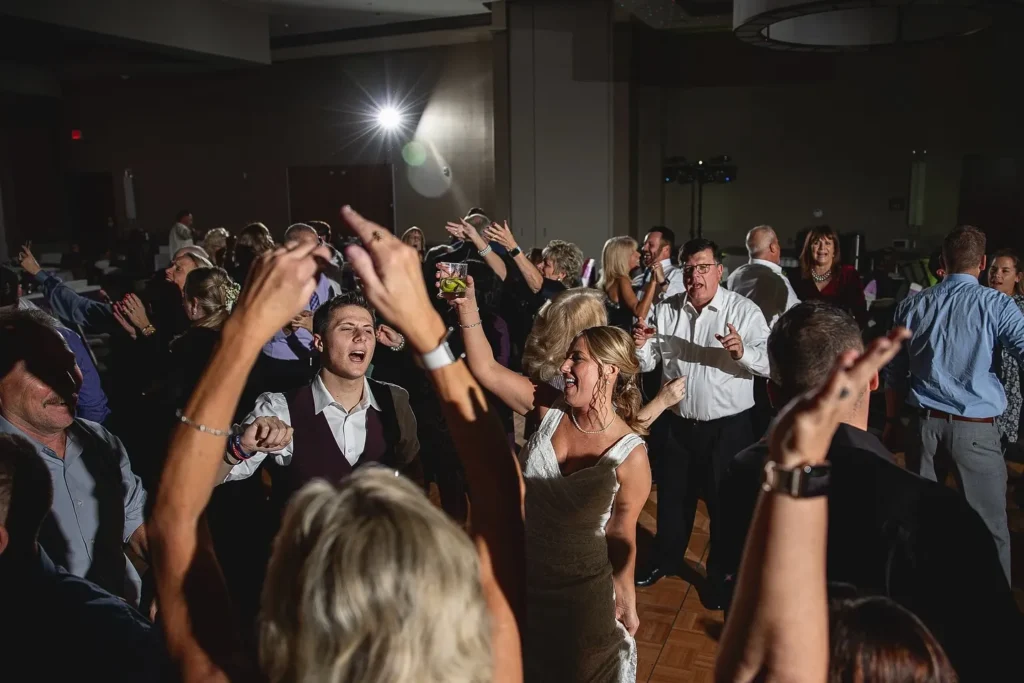 People dancing on a dance floor at a wedding