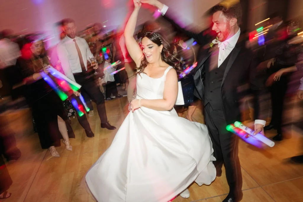 bride and groom dancing on a lively and big dance floor