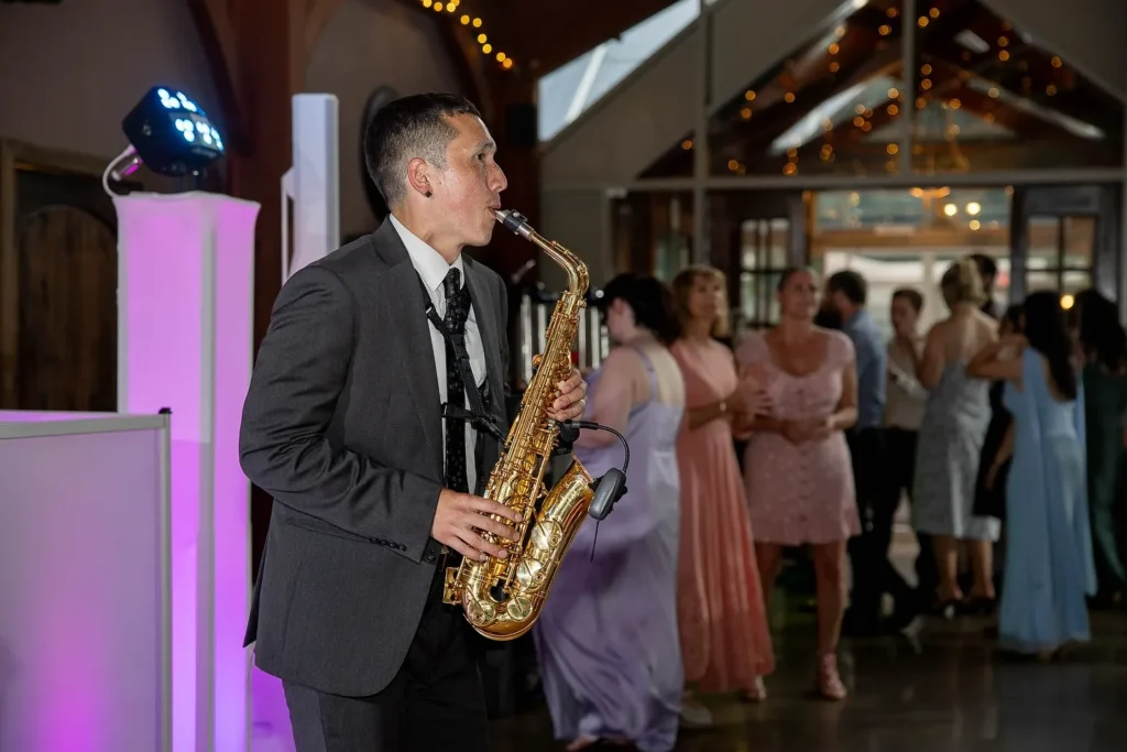 Premier Wedding DJ and saxophone player providing DJ entertainment at wedding